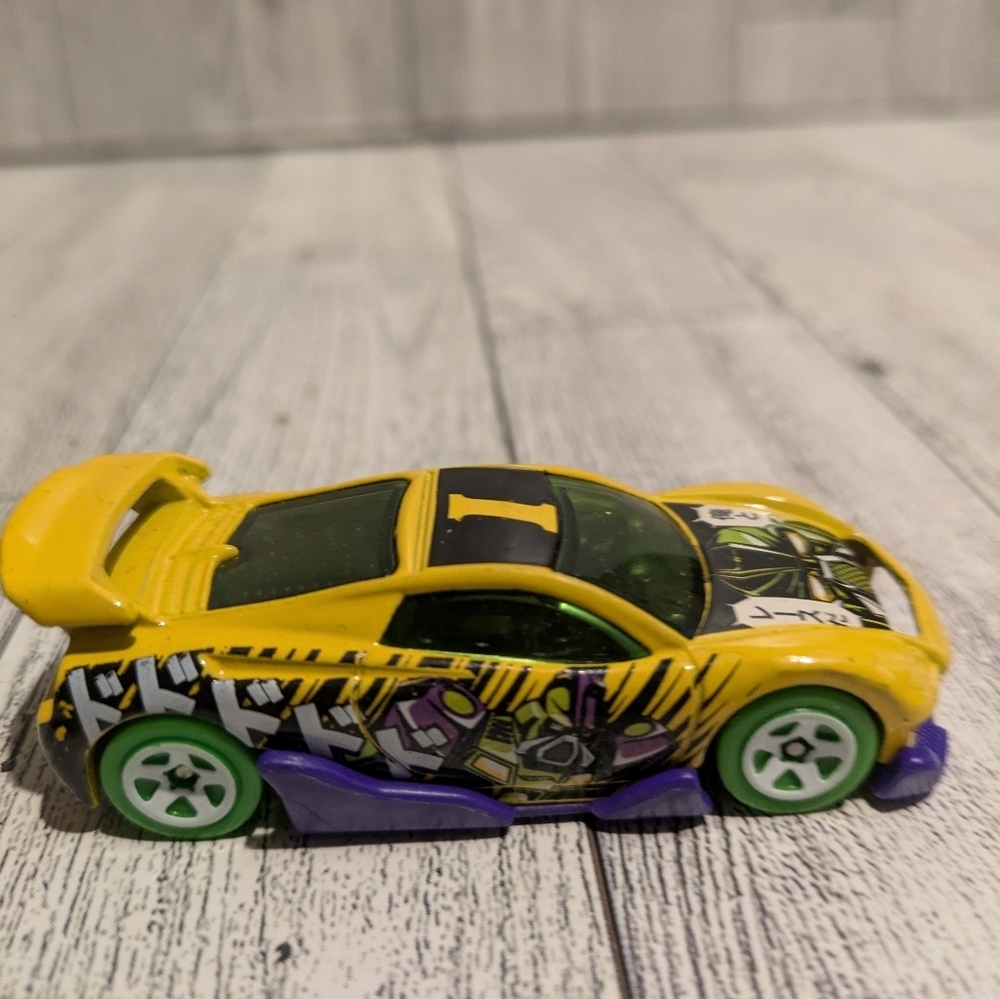 hot Wheels Yellow Graphic Racing Toy Car with Green Wheels